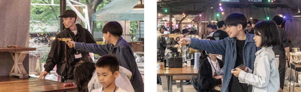 子供向けイベント　射的で遊ぶ子供たち